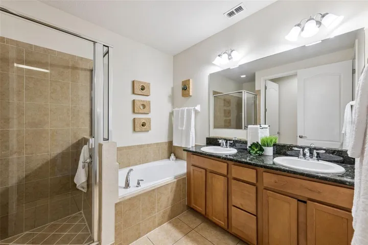 Primary Bathroom has double sinks and granite counters