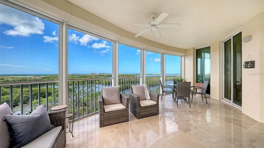 Expansive lanai with sweeping views & access from living area & primary suite
