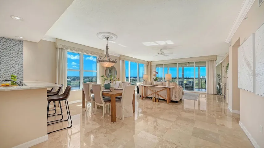 Living, dining, kitchen area with sweeping water views