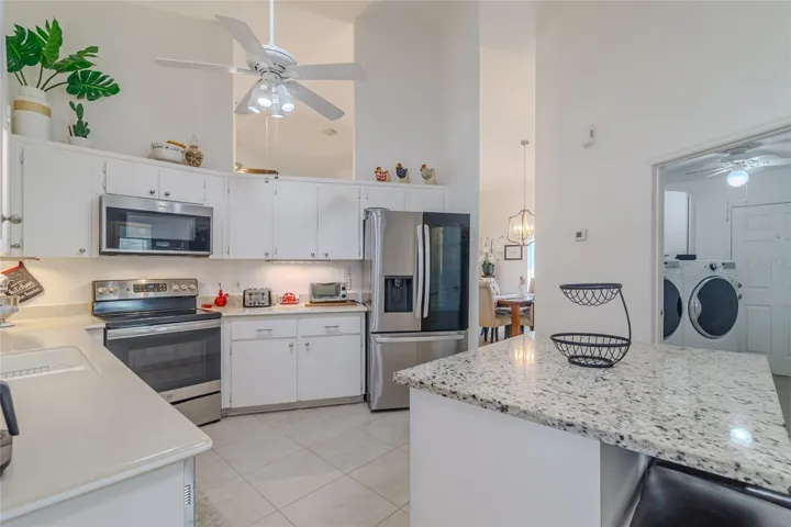 Remodeled Kitchen with ceiling fan, built-in microwave, clear top range, French door refrigerator, plus much more