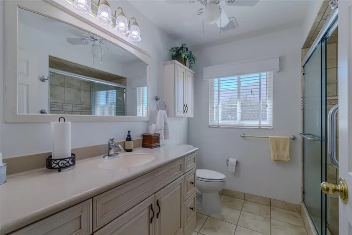 Guest Bathroom with New Lighting fixtures, upgraded vanity and walk-in shower
