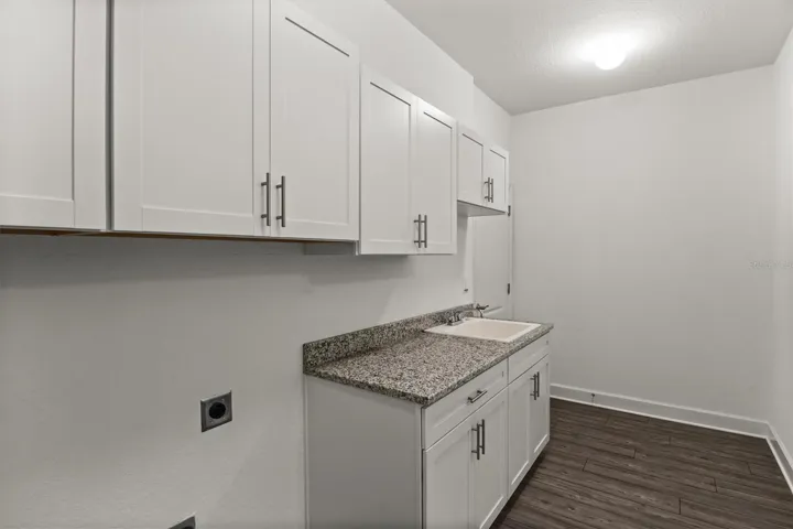 Laundry Room with Cabinets, Sink and Granite countertop