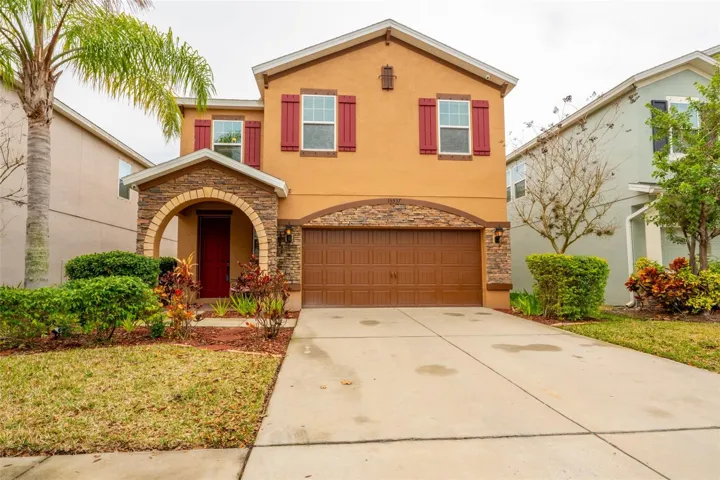 BRICK ACCENTS COMPLIMENT THE RECENTLY PAINTED EXTERIOR
