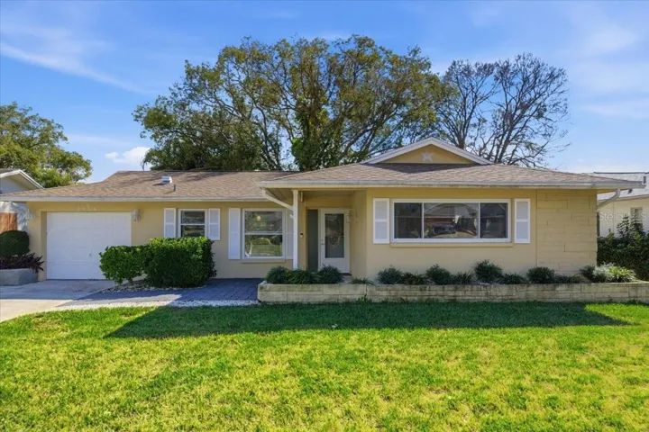 Welcome to 2954 Curling Ct in Highland Lakes, Palm Harbor’s premier 55+ golf course community.