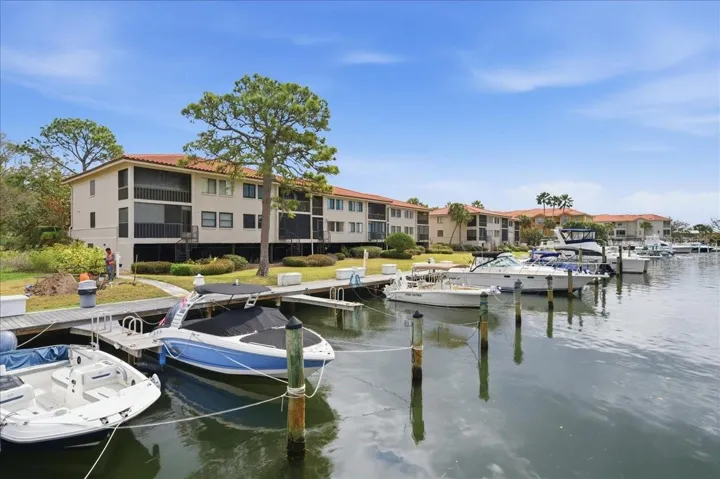 Tarpon Cove’s resort-style amenities include: two pools and spa, tennis courts, exercise facility, putting green, fishing pier, Kayak storage & launch, recreational clubhouse, waterfront nature walking trail, grill and picnic areas, and a private deep water channel with  direct gulf access - no bridges!