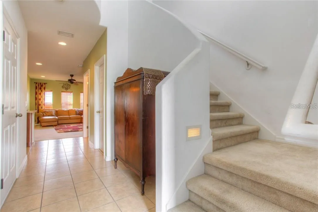 Entry to Stairs, Guest Half Bath, Pantry, Kit. FR. DR