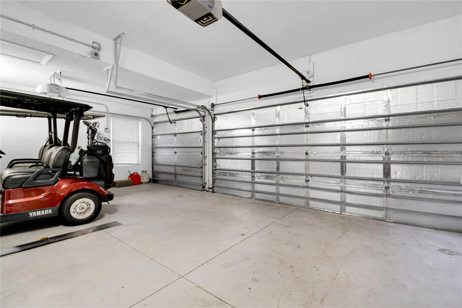 Climate Controlled 3 car garage with a mini-split A/C unit and insulation