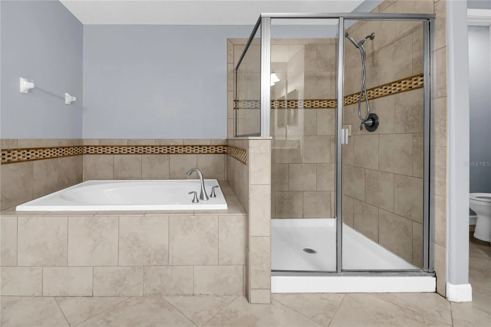 Upstairs Master Bathroom has a soaking tub and walk in shower