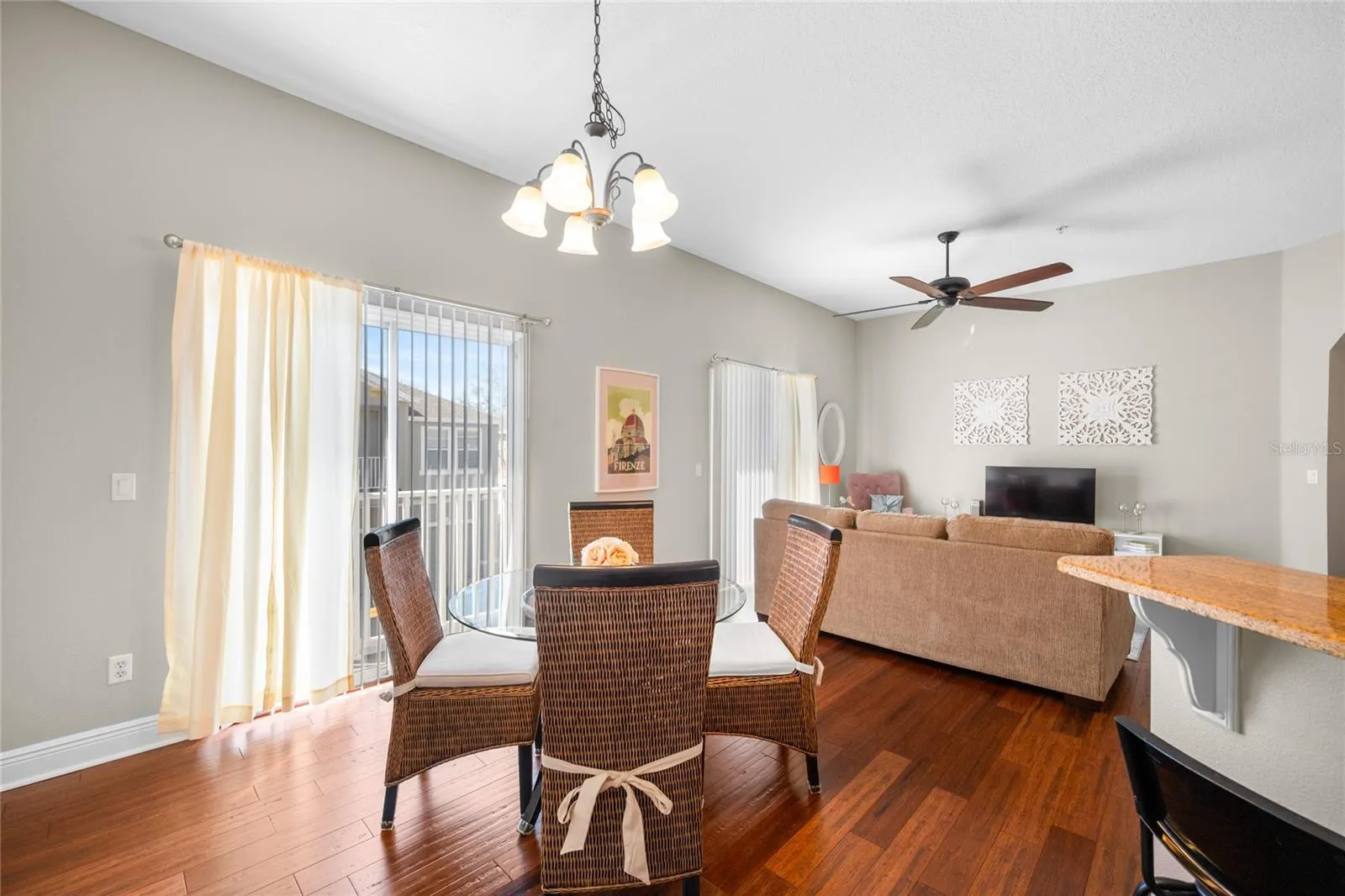 Dining and living areas feature bamboo flooring and abundant natural light
