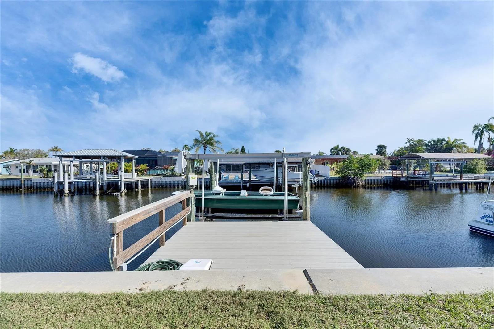 Private dock and 10,000 lb boat lift included exclusively with this unit — a rare Apollo Beach condo feature.