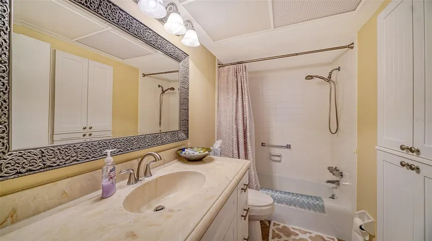 The primary bath has linen storage and a tub/shower combo...