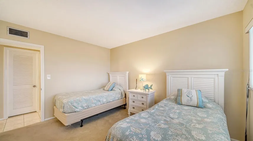 The door on the left opens into a very large storage closet that doubles as a walk-in closet for the 2nd bedroom...