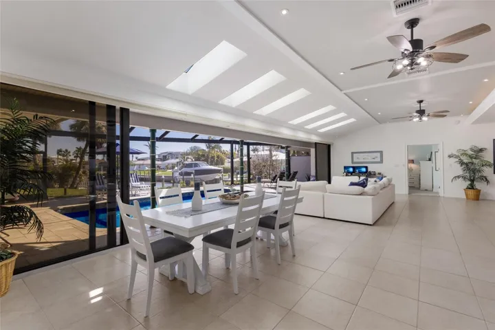 Open Floor Plan with Full Wall of Impact Sliding Doors, open up for an amazing indoor/outdoor feel.  The orientation of the home creates exceptional privacy and tranquility compared to others within the community.