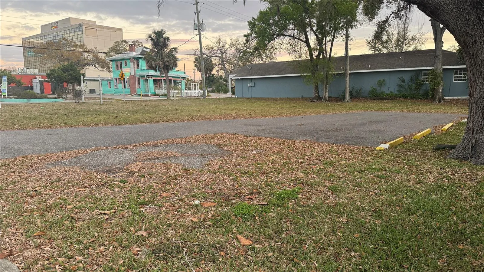 Looking Southwesterly across the Vacant Corner Lot (100 x 100).  NOTE: "The Yellow House and its lot are right next door and go with the sale (being sold together only). Total amount of land is 150' x 100'.