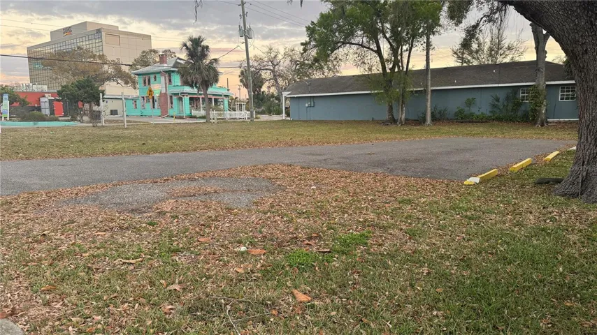Looking Southwesterly across the Vacant Corner Lot (100 x 100).  NOTE: "The Yellow House and its lot are right next door and go with the sale (being sold together only). Total amount of land is 150' x 100'.