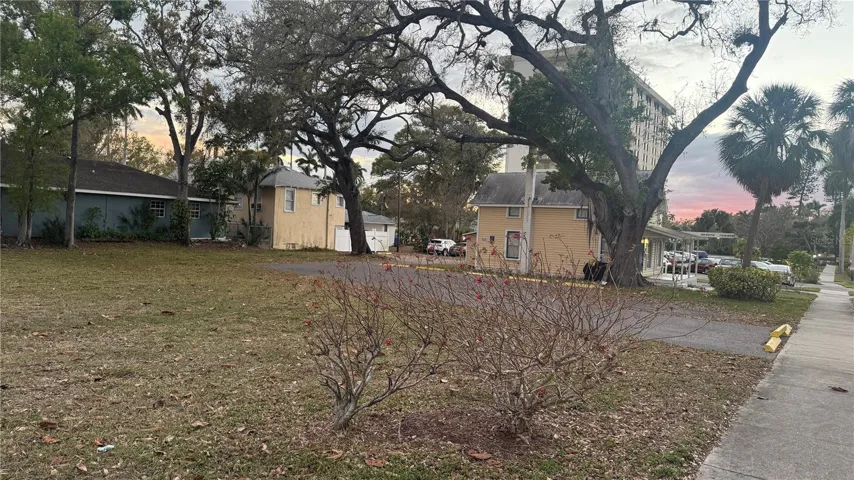 Big Corner Lot (100 x 100) + cute yellow house (50 x 100 lot).  Total 150 x 100 rectangular shaped property.  Ready to build on.