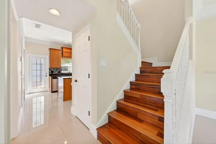 Tile and engineered hardwood floors throughout.