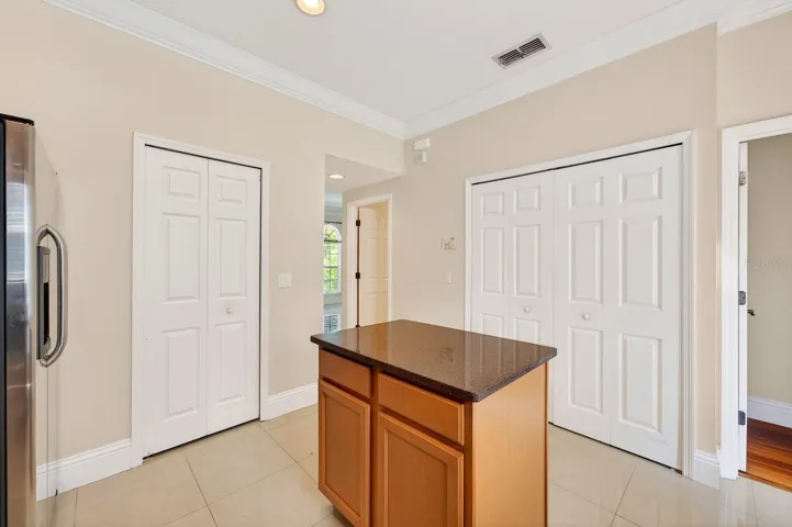 Kitchen features a prep island for additional storage.