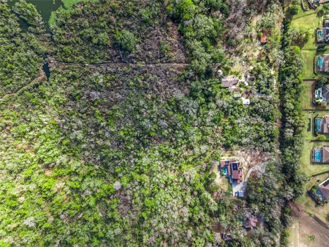 Aerial directly over property between neighbors