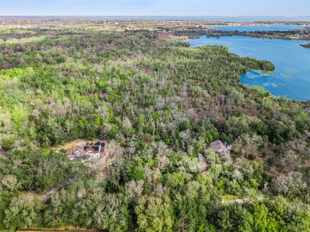 Aerial of Lot between houses Lake Apopka in background