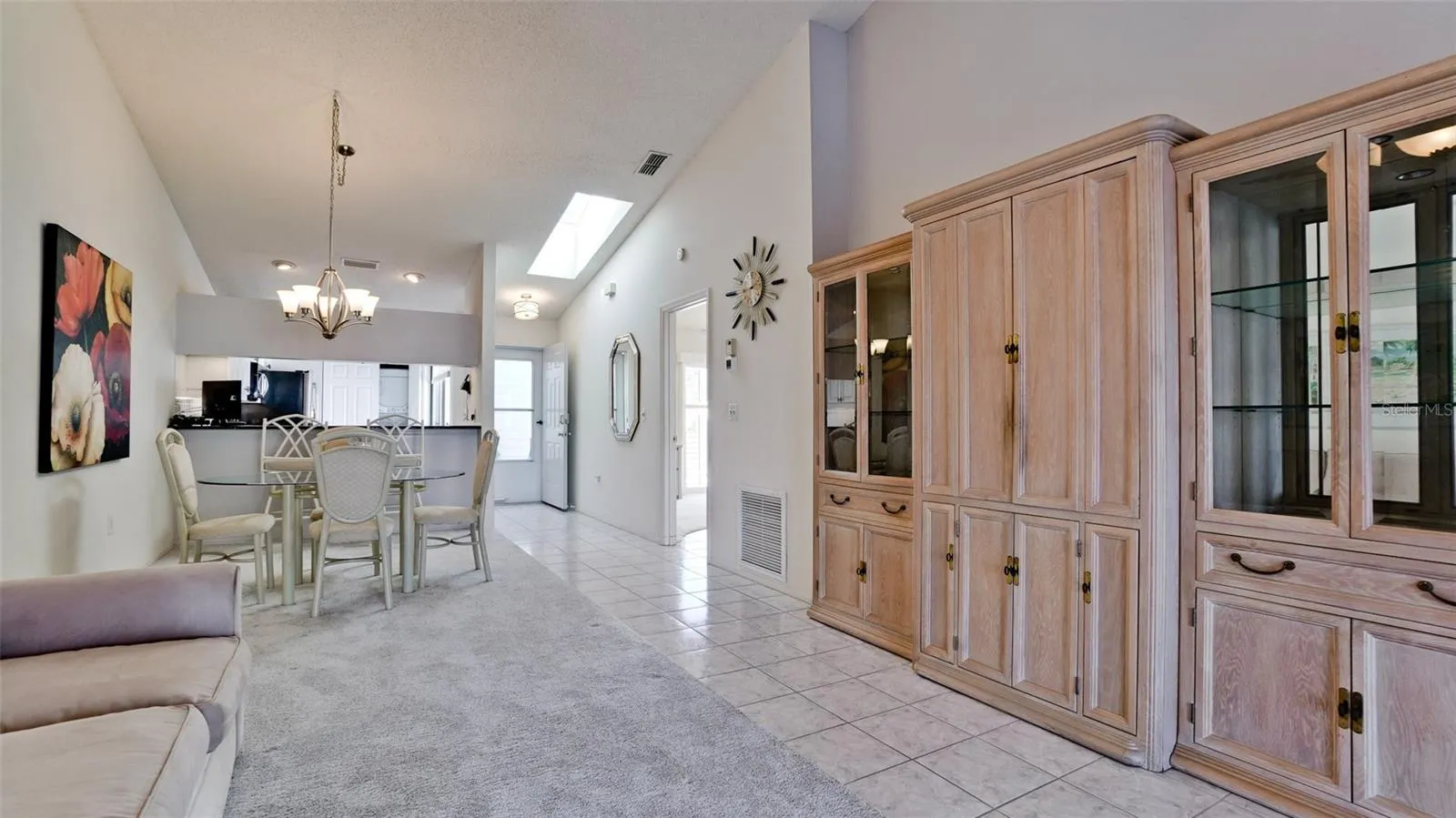 TV ENCLOSED IN ENTERTAINMENT CENTER