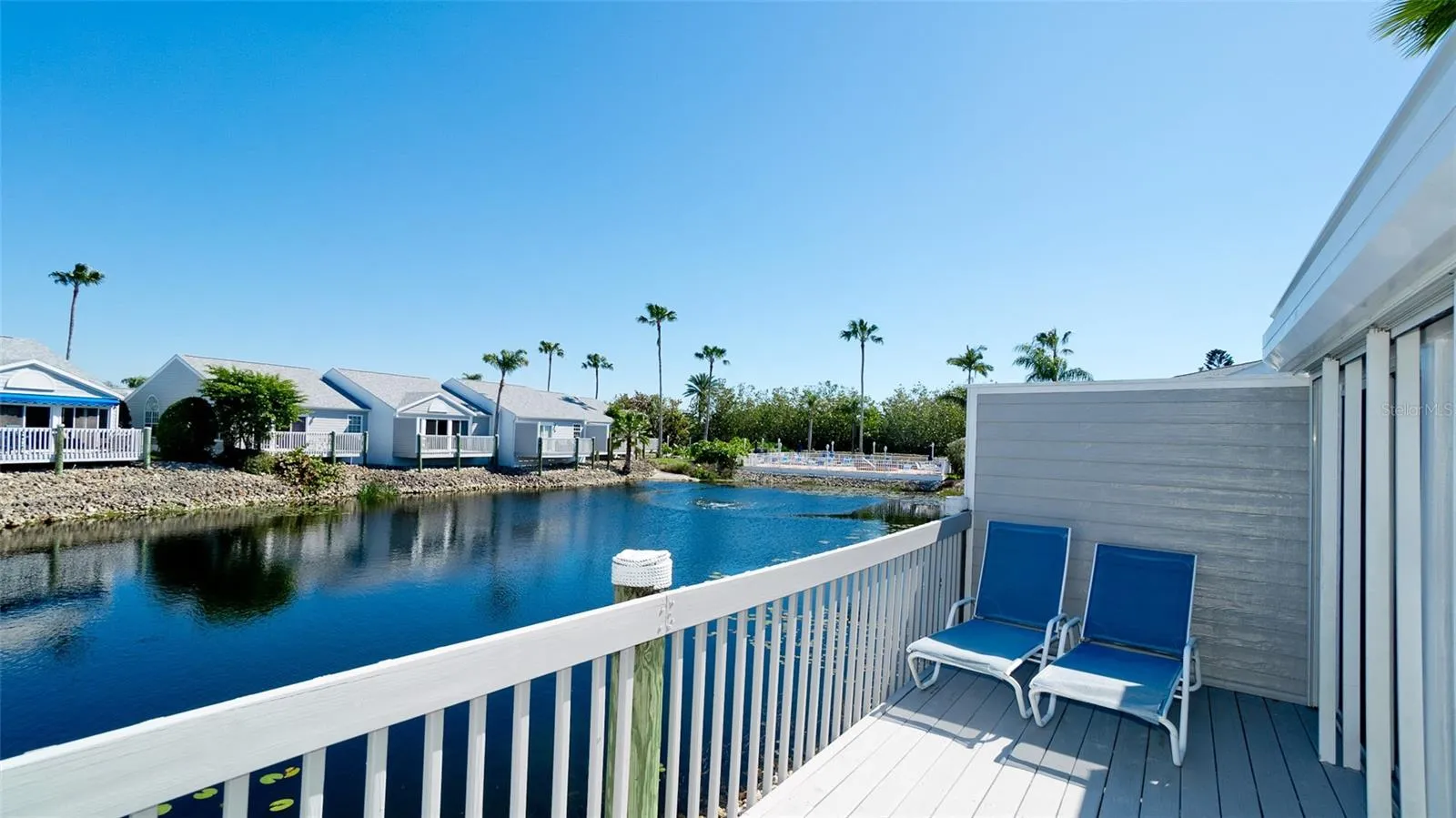 LAKEFRONT VILLA WITH 2 CAR GARAGE IN PERICO BAY CLUB