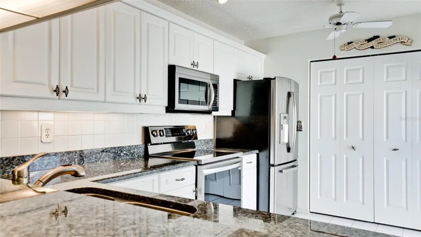 GRANITE COUNTERS WHITE CABINETRY