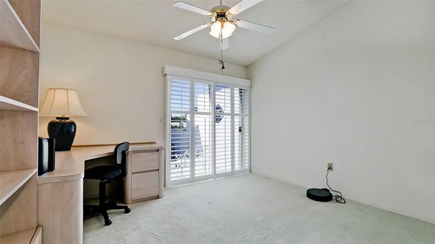 SECOND BEDROOM HAS OFFICE FURNITURE &amp; WHITE PLANTATION SHUTTERS