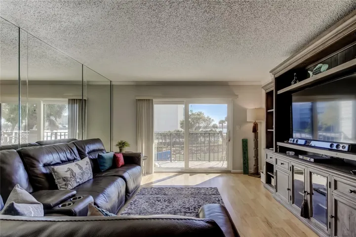 Living Room with sliders leading to tiled balcony