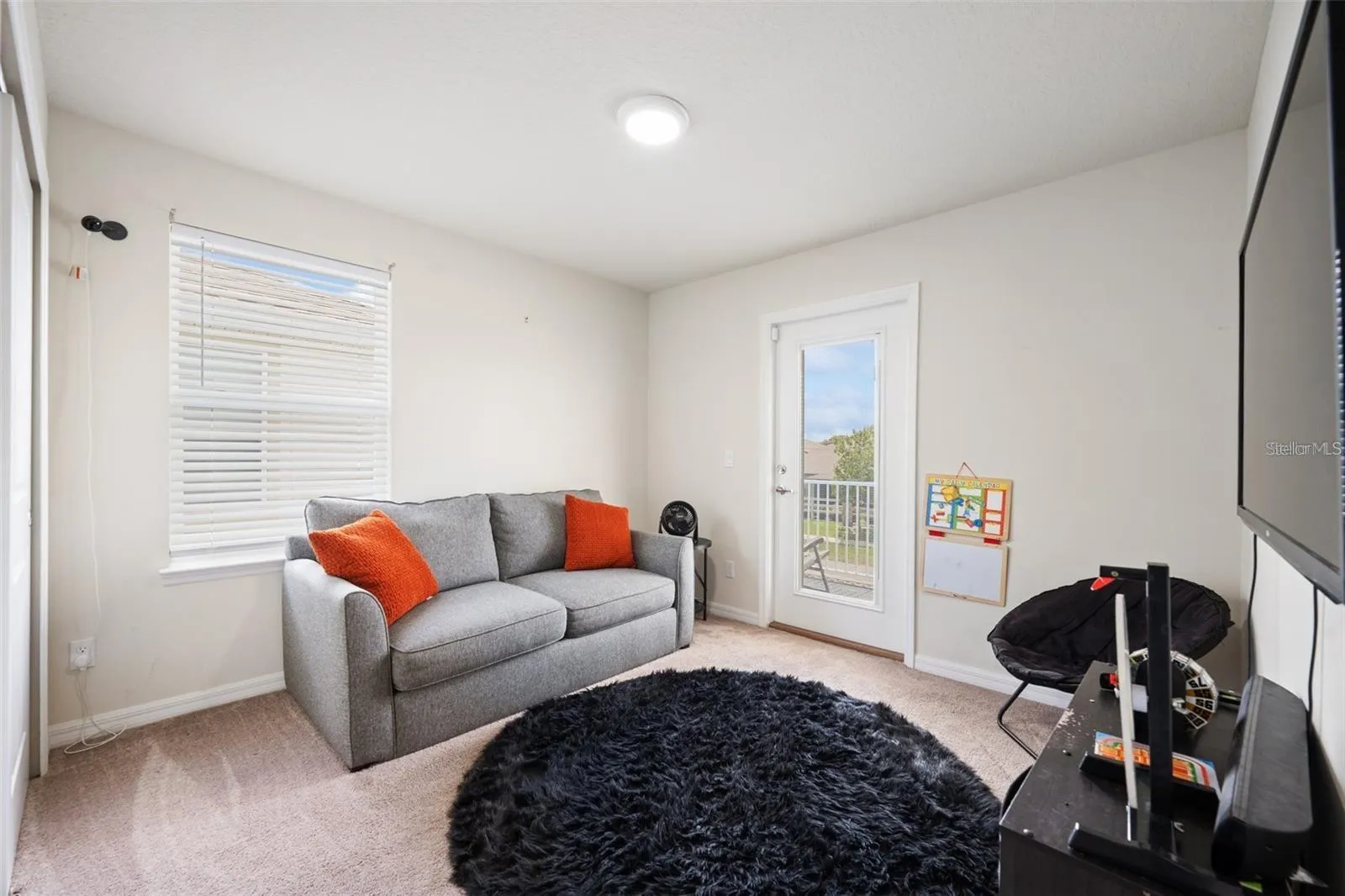 Third bedroom that can be used an an office with the balcony attached to the bedroom.