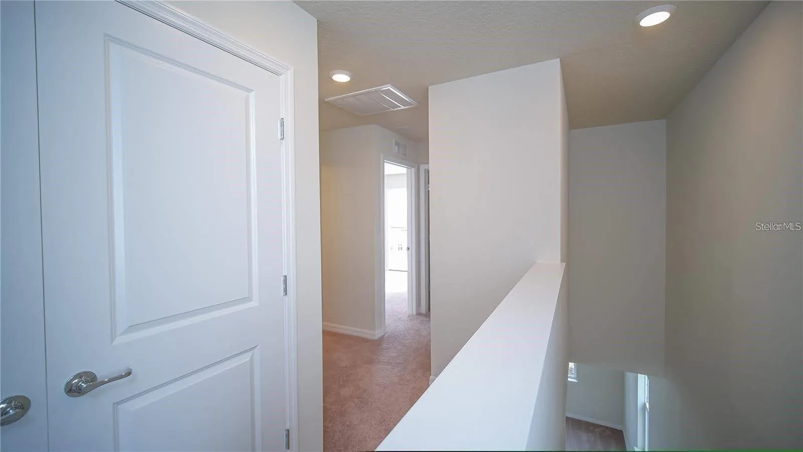 Upon coming upstairs the laundry room is behind those double doors.