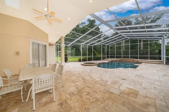 Screened Swimming Pool with Travertine Lanai