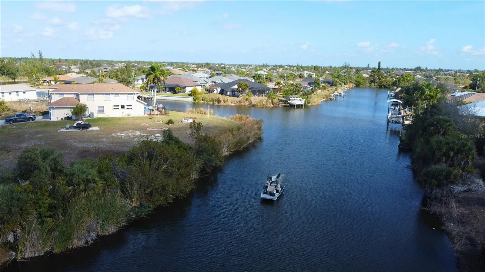 Aerial view of residential area featuring a large body of water