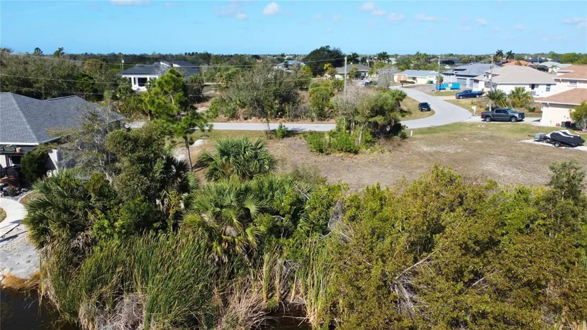 Aerial perspective of suburban area featuring a tree filled landscape