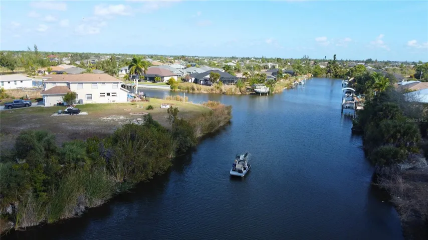 Aerial view of residential area featuring a large body of water