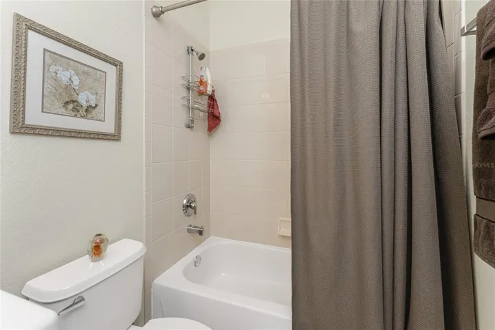 Guest bath has a combo tub/shower