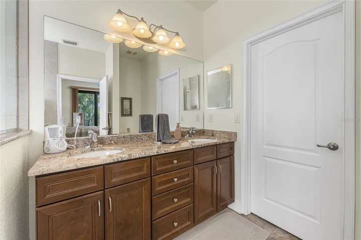 Double basin vanity w/granite countertop