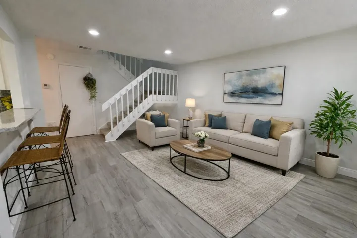 Virtually Staged - Living area with new flooring and freshly updated