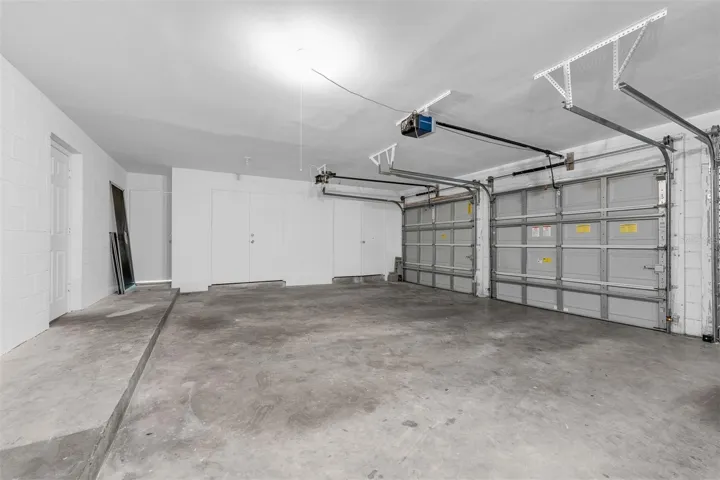 Kitchen door opens to shared garage