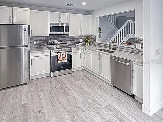 Newly remodeled kitchen!  All new appliances and cabinets - travertine countertops.