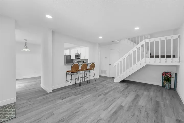 Living area with breakfast bar is open to the kitchen