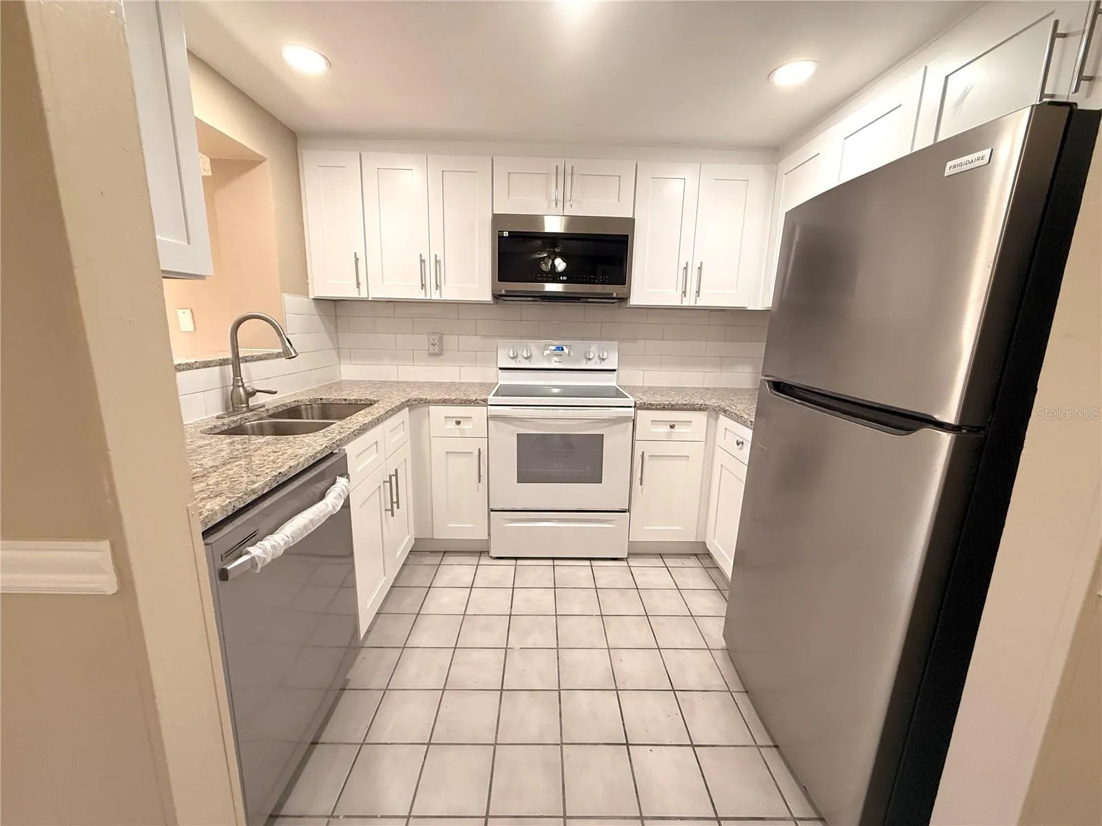 Must see!  New kitchen cabinets and granit counters.