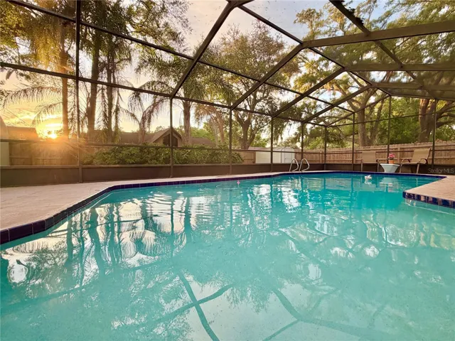 Beautiful, oversized pool and pool cage with daily sunsets!