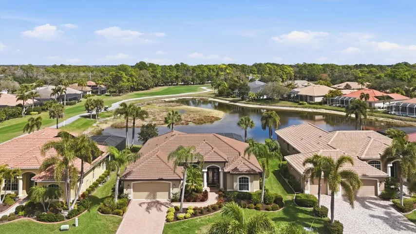 The Sanctuary at Pelican Pointe with gated entrance on Hatchett Creek Blvd.