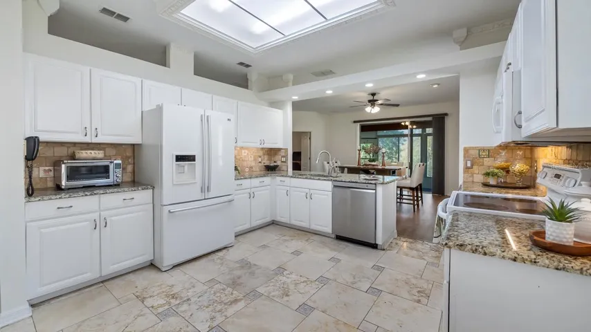 Kitchen with Tile Floor and Tile Backsplash