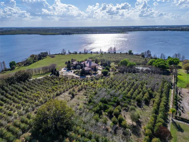 A rare opportunity to own one of Auburndale’s most impressive private estates. Set on 44.30 beautifully landscaped acres with more than 2,300 feet of water frontage, this remarkable property offers unmatched privacy, scale, and natural beauty.