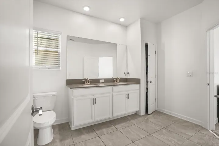 Spacious bath with extended vanity.