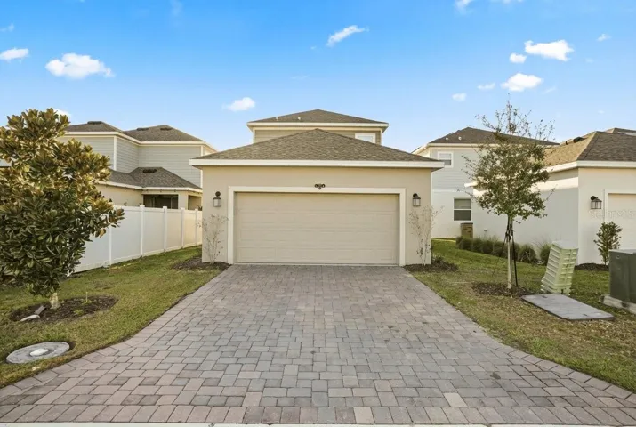 Driveway and two-car garage exterior.