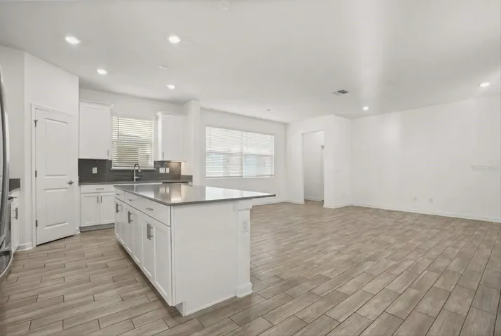 Open living space with seamless kitchen integration.