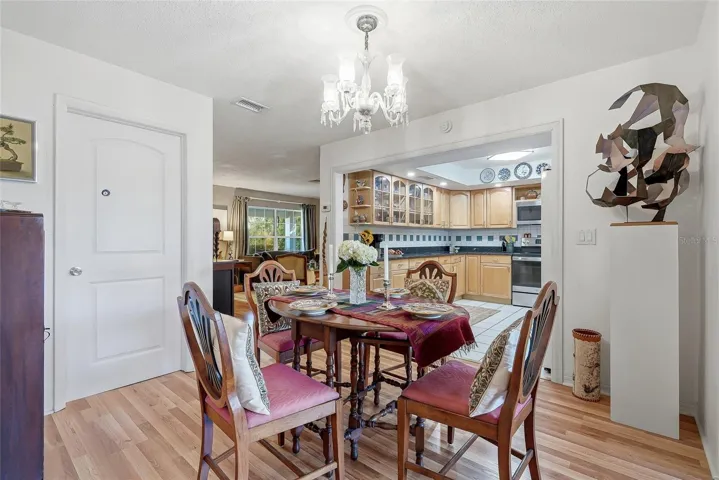 From everyday meals to special occasions, the dedicated dining area offers an inviting place to gather beside the family room.